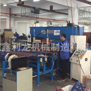 What is the purpose of adding an automatic feeding system to a die cutting press machine?